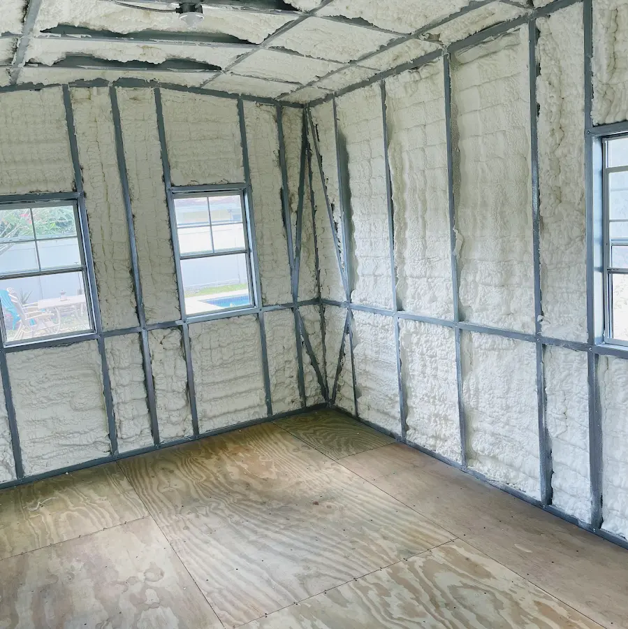 Closed-cell spray foam insulation applied to wall cavities in a residential project in Monessen